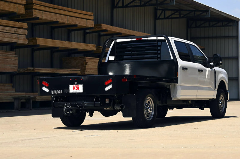 White Ford Super Duty with a black CM Warrior flatbed